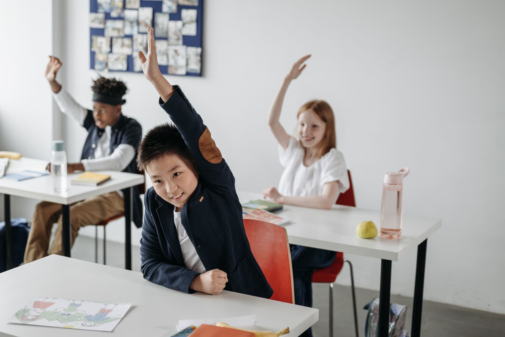 School students in a classroom, representing the K-12 schools Primegate represents