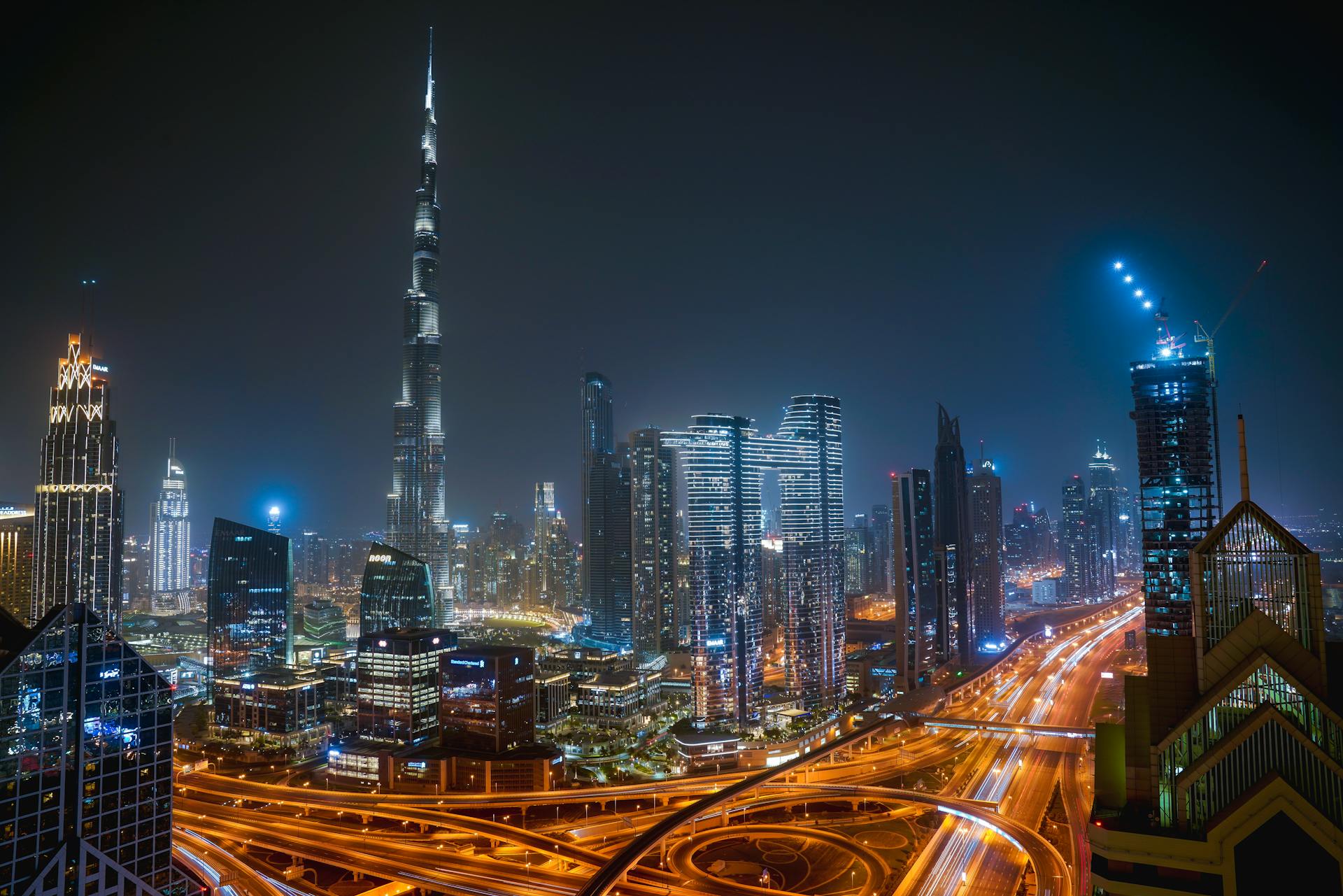 Dubai skyline at night with the Burj Khalifa and Sheikh Zayed Road